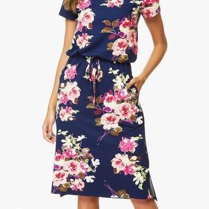 New with tags dress. Navy blue with floral print.